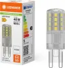 A product package and the light bulb it contains are shown against a white background. Produktbild-Vorschau