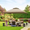 A backyard patio with a gazebo and outdoor furniture. Produktbild-Vorschau