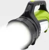 A close-up shot of a green and black flashlight with its light on. Podgląd zdjęcia produktu