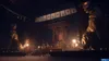 A dimly lit, atmospheric scene inside what appears to be a shrine or temple, with large statues on either side, ornate architecture in the background, and numerous small lanterns casting a warm glow. Produktbild-Vorschau
