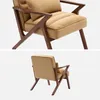 Two views of a camel-colored velvet armchair with a wooden frame, presented against a white background. Produktbild-Vorschau