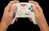Hands holding a white Nintendo Switch controller with Zelda-themed decorations. Anteprima dell’immagine prodotto