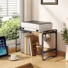 A desk setup with a printer on a shelf, books, headphones, and a tablet. Produktbild-Vorschau