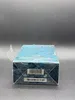 A close-up side view of a product box with a blue textured pattern. Náhled obrázku produktu