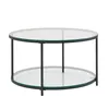 A round coffee table with two glass shelves and a black metal frame, presented on a white background.