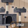 Close-up view of a multi-level cat tree with hanging toys and a cat house. Produktbild-Vorschau