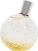 A perfume bottle with a spherical shape and a silver cap, decorated with gold stars and text. Anteprima dell’immagine prodotto