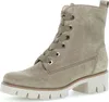 A single grey suede biker boot with laces and a thick white sole, shown from a side-diagonal angle on a white background. Produktbild-Vorschau