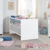 A nursery room with a white crib, bedding, and decorative items. Produktbild-Vorschau