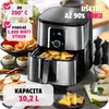 An air fryer with food in the basket, surrounded by ingredients like chili peppers, carrots, and spices, along with some prepared food items. Náhled obrázku produktu