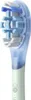 A close-up shot of an electric toothbrush head with blue and white bristles, attached to a light green handle. Anteprima dell’immagine prodotto