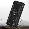 A black phone case with a ring holder is shown in a dynamic pose, appearing to be dropped onto a rocky surface. Produktbild-Vorschau