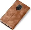 A brown leather flip case for a smartphone is shown against a white background. Produktbild-Vorschau