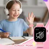A young girl wearing headphones and a blue shirt is sitting at a desk, waving and smiling. A pink smartwatch is visible on her wrist, displaying a "school mode" icon. The text "SCHOOL MODE" is overlaid at the bottom of the image. Produktbild-Vorschau