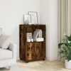 A wooden cabinet with two doors and shelves, placed in a room next to a sofa and a plant. Náhled obrázku produktu