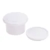 A white plastic lid and container are shown on a white background. Voir les images du produit