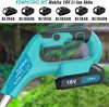 A close-up of a teal and black battery-powered trimmer with a battery pack attached. The background is blurred green foliage. Produktbild-Vorschau
