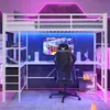 A modern loft bed with a desk and gaming chair, illuminated by colorful LED lights. Podgląd zdjęcia produktu