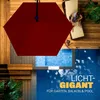An overhead view of a red umbrella shading a pool area with people relaxing nearby. Produktbild-Vorschau