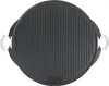 A top-down view of a round, black cast iron grill plate with raised ridges and two silver spring handles on the sides. Náhľad obrázku produktu