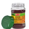 A jar of sumak spice with its lid off, placed on a white background. Produktbild-Vorschau