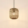 A hanging lamp with a natural rattan shade. Produktbild-Vorschau