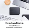 A desk setup with a laptop, external hard drive, keyboard, and coffee. Produktbild-Vorschau