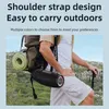 A person hiking outdoors with a backpack and a speaker. Produktbild-Vorschau
