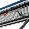 A close-up view of the underside of an ironing board, showing the metal mesh surface and a black lever with a red handle. Produktbild-Vorschau