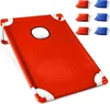 A red cornhole board with white frame and a hole in the center, with red and blue bean bags in the background. Produktbild-Vorschau