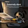 A desk setup with a laptop, a globe, and a vertical mouse, illuminated by a desk lamp. Produktbild-Vorschau