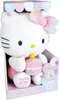 A Hello Kitty plush toy in its packaging, holding a birthday cake with a candle. Anteprima dell’immagine prodotto