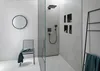 A modern bathroom with a shower, chair, and towel rack. Anteprima dell’immagine prodotto