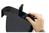 A hand is inserting batteries into a black electronic device. Podgląd zdjęcia produktu