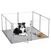 A dog is lying in a dog playpen with two food bowls. Anteprima dell’immagine prodotto