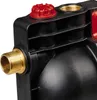 Close-up view of a black plastic pump housing with brass fittings and a red cap. Produktbild-Vorschau