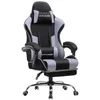 A gaming chair with a footrest, headrest, and lumbar cushion. Produktbild-Vorschau