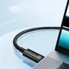 A close-up shot of a black USB-C cable plugged into a silver laptop. Náhľad obrázku produktu