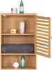 A wooden bathroom cabinet with its door open, displaying various toiletries and a towel. Produktbild-Vorschau