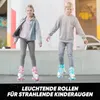 Two children are roller skating outdoors, with colorful graffiti on a wall in the background. Produktbild-Vorschau