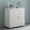 A white cabinet with a door and drawers is shown in a bathroom setting. Náhled obrázku produktu