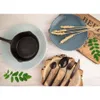 A flat lay of kitchenware and decorative elements on a wooden surface. Náhled obrázku produktu
