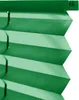 A close-up view of a green pleated blind. Produktbild-Vorschau