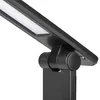 A close-up view of a black desk lamp's adjustable joint and LED light bar. Podgląd zdjęcia produktu
