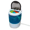A portable washing machine with its lid open, filled with colorful clothes. Produktbild-Vorschau