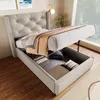 A bed with its storage compartment open, revealing stored items and pillows, in a well-lit room with a large window. Produktbild-Vorschau