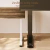 Close-up of two desk legs, one white and one black, with text overlays. Náhled obrázku produktu