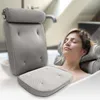 A woman relaxing in a bathtub with a bath pillow. Anteprima dell’immagine prodotto