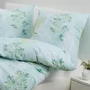 A close-up view of bedding with a botanical print. Produktbild-Vorschau