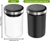 Two vacuum storage containers are shown side-by-side against a white background. The container on the left is made of clear glass, and the container on the right is made of black stainless steel. Dimensions are indicated with measurement lines and text. Náhled obrázku produktu